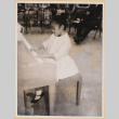 Susan playing piano (ddr-densho-522-596)