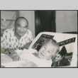 Chester Sakura, St., sitting by Hideko Kondo laying in bed (ddr-densho-523-332)