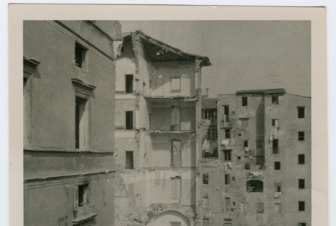 Damaged building and debris in Italian city (ddr-densho-368-58)