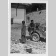 [Men in military uniform with military vehicle] (ddr-csujad-1-14)