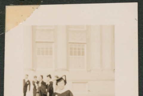 Graduate holding her diploma (ddr-densho-433-786)