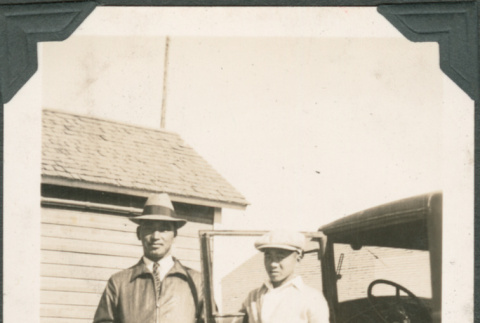 Mike Sakahara with nephew Noboru Sakahara standing next to truck (ddr-densho-316-324)
