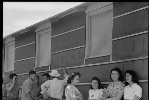 Japanese Americans standing in shade (ddr-densho-151-280)