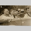 Franklin D. Roosevelt wearing leis in a car (ddr-njpa-1-1612)