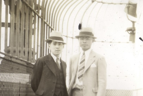 Two men on top of Smith Tower (ddr-densho-128-27)