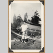 Young woman with bicycles (ddr-densho-542-235)