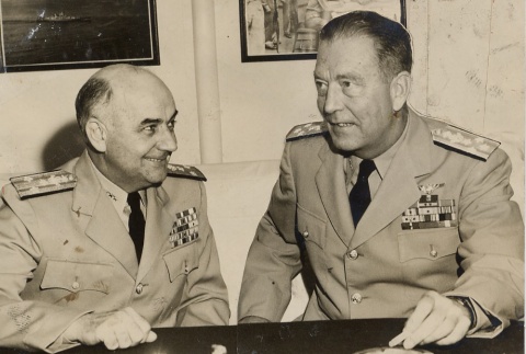 Arthur D. Struble posing at a desk with another military leader (ddr-njpa-1-1812)
