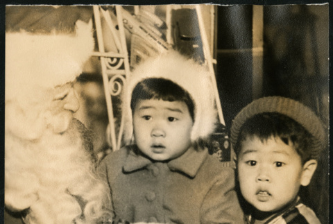 Janice and Michael Bitow meet with Santa Claus (ddr-densho-395-43)