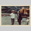 Kaneji Domoto (in hat) and unidentified man by pond with bulldozer (ddr-densho-377-1345)