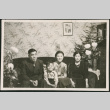 Family sitting on sofa (ddr-densho-293-118)