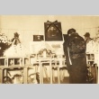 Woman bowing at a funeral altar (ddr-njpa-4-2157)