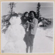Yoshiko Shiomi holding Susan Shiomi next to snowman (ddr-densho-522-240)