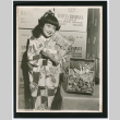 Girl posing with Umeya product (ddr-densho-499-22)