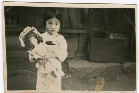 Girl with doll (ddr-densho-423-561)