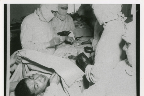 Person undergoing medical procedure (ddr-densho-1007-185)