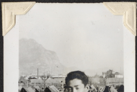 Man with tents in background (ddr-densho-466-709)
