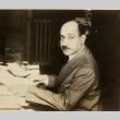 A man seated at his desk (ddr-njpa-1-2331)