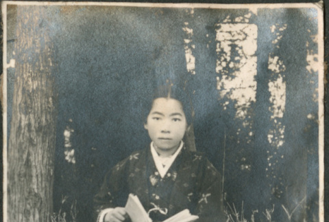 Girl holding book (ddr-densho-293-47)