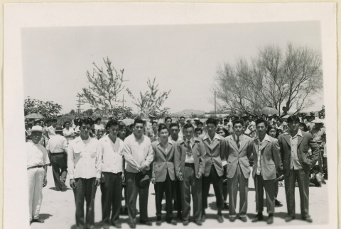 Men standing on send off day (ddr-densho-37-1434)