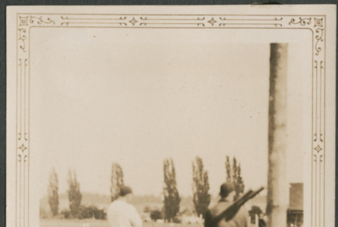 Men in baseball uniforms on field (ddr-densho-316-282)