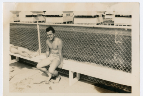William Iino on bench in swimwear (ddr-densho-368-276)