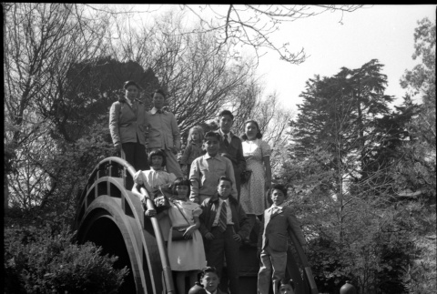 Children standing on Moon Bridge in Japanese Garden in Golden Gate Park (ddr-densho-426-965)