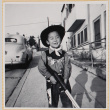 William Shiomi in cowboy costume with toy gun (ddr-densho-522-259)