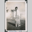 Man and baby standing on lawn (ddr-densho-483-633)