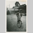 A girl on a bicycle (ddr-densho-338-48)