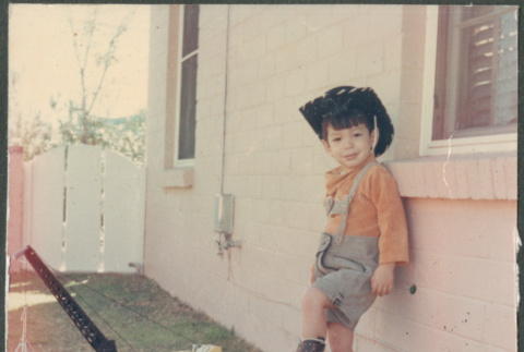 Boy in cowboy hat with truck (ddr-densho-523-548)