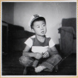 William Shiomi sitting on floor (ddr-densho-522-251)