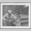 Man and woman sitting on steps (ddr-densho-434-492)