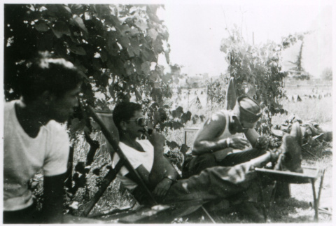 Three relaxing outside (ddr-densho-1007-831)
