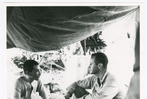 Two soldiers under a tarp (ddr-densho-1007-299)