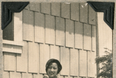 Woman dressed up outside house (ddr-densho-383-107)