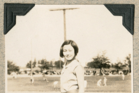 Hatsue Aoki standing in field (ddr-densho-383-266)