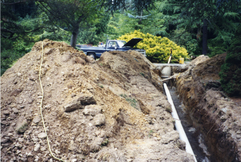 Pipe in ditch, drainage work related to Stroll Garden construction (ddr-densho-354-1824)