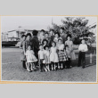 Large group of men, women and children in yard outside house (ddr-densho-522-62)