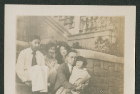 family sitting on steps (ddr-densho-378-549)