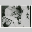 Person undergoing medical procedure (ddr-densho-1007-185)