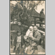 Man with three children by lantern and bridge (ddr-densho-293-199)