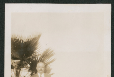 man in front of a palm (ddr-densho-378-383)