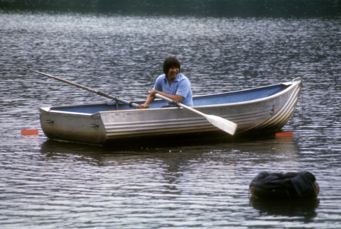 Stuart Wong trying to retrieve a bag in the water (ddr-densho-336-880)