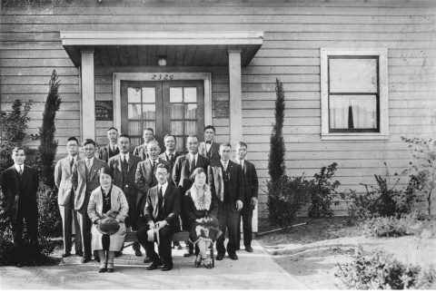 Group of men and women posing in front of building (ddr-ajah-6-611)