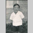 Chester Sakura Jr. making a face for the camera (ddr-densho-523-211)