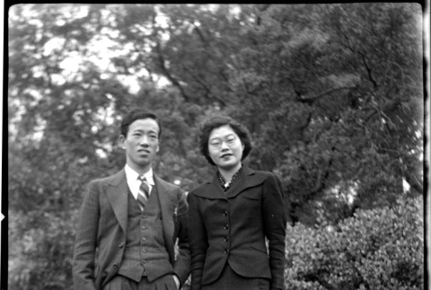 Tomoye (Nozawa) Takahashi and unidentified man standing in yard (ddr-densho-426-2180)