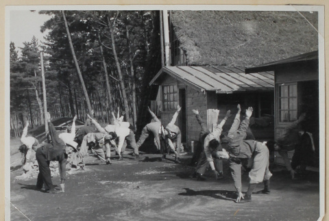 Group doing crossover toe touches (ddr-densho-433-709)