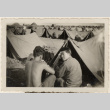 Three men sitting outside tent (ddr-densho-466-384)
