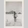 Woman holding bags in the snow (ddr-manz-7-87)