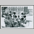 Group sitting outside (ddr-densho-293-195)